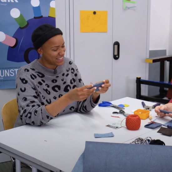 Two people at a table crafting together.